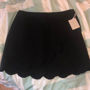 NWT black scallop-hem mini skirt
